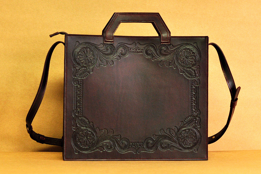 moli皮具,般若图案手拎包