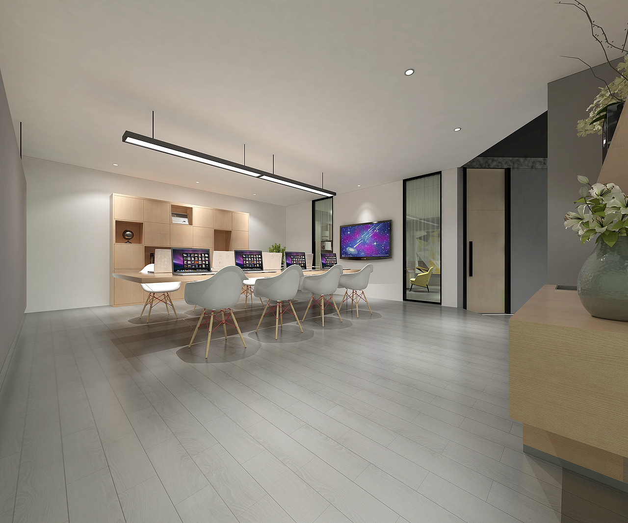 集中办公区大面积的灰白色调,简单的颜色和灯光布置,挂着的电视机丰富