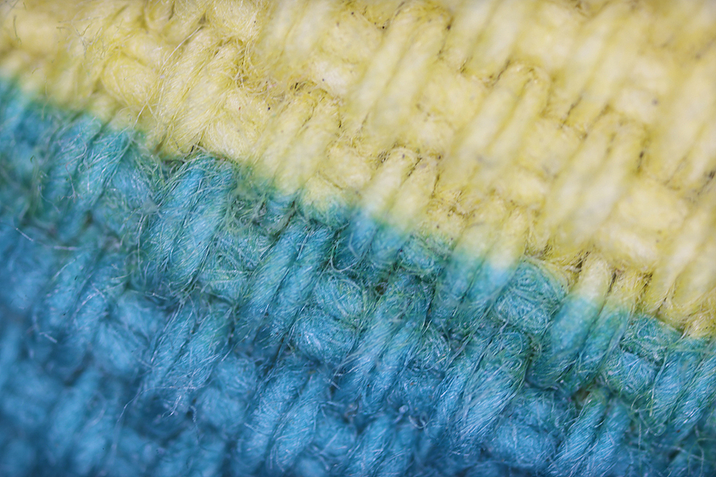 纹理毛衣黑色黄色背景纹理图案细节展示微距摄影素材