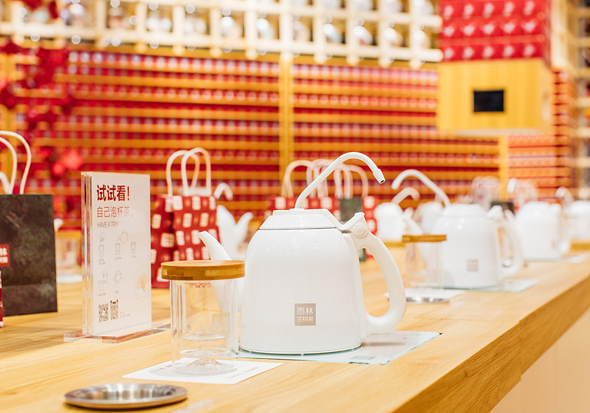 容品牌:茶饼搭建茶立方_雨林古茶坊茶博会展厅策划