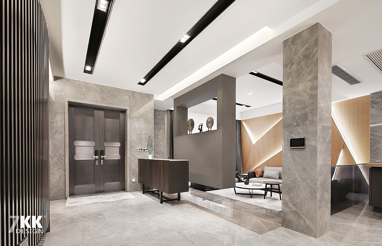 一楼有两个入口这是主入口,进门左边放置矮的装饰鞋柜,鞋柜后面用背对着的电视背景墙,用灰色门槛石来作为玄关和客厅的区域分割,电视背景墙采用深灰色质感大理石材质,在和餐厅的分割界线中采用浅灰色纹理大理石。在进门右侧的墙面造型上采用竖条状的铝条造型墙面,线条型的利用让整个玄关和客厅的空间有了空间的延伸感,质感,大气又很有仪式感。