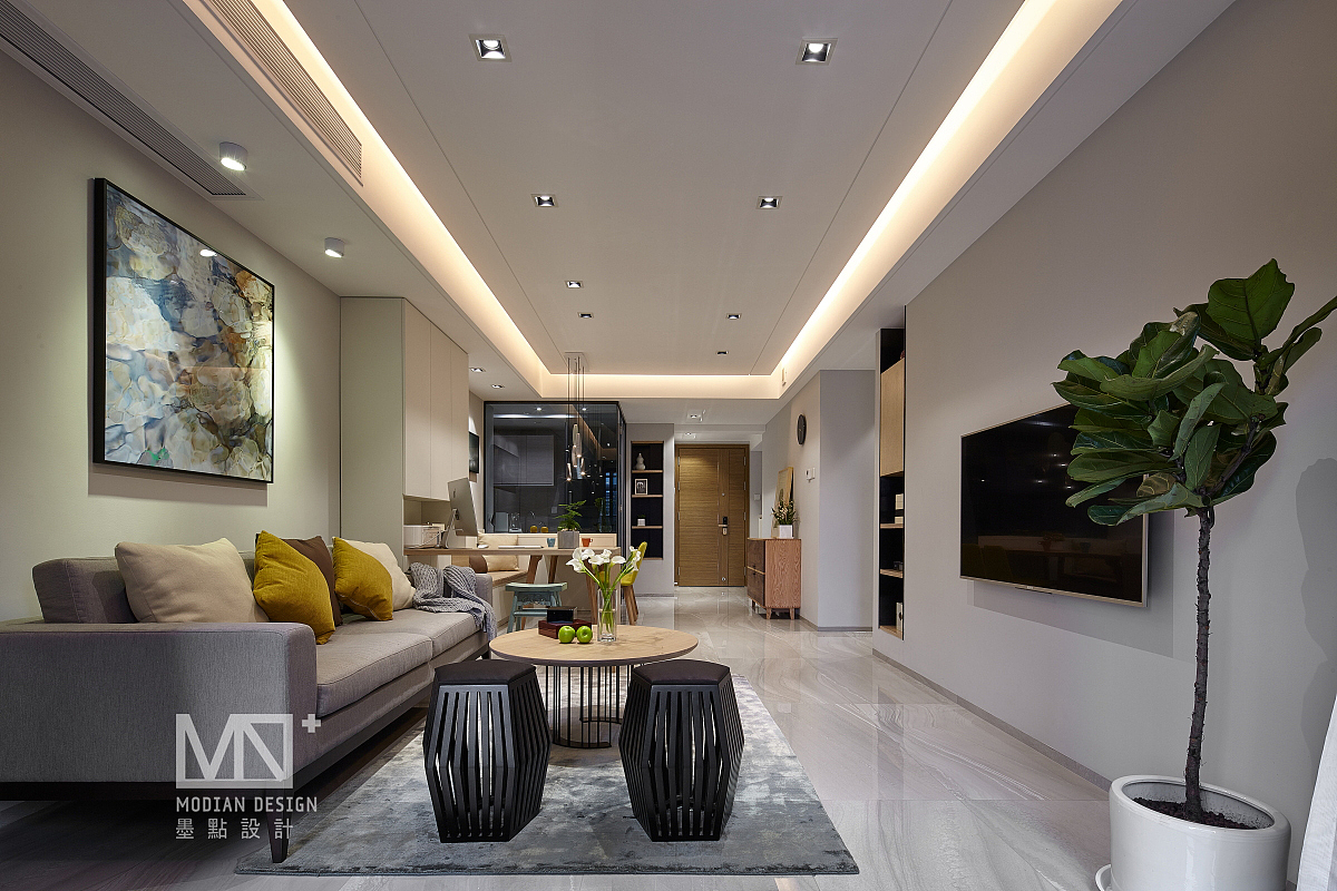 客厅 br>客厅的处理简洁利落,整体以白色打造出了干净明亮的空间,透过