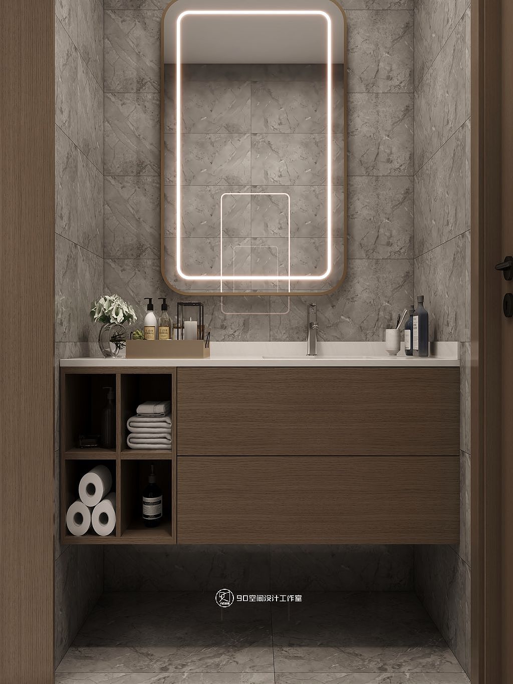 卫生间干湿区分离,洗漱区单独嵌入两墙之间,采用灰色纹路的墙砖与原木柜布置而成。
开门进入淋浴区,黑框简装玻璃隔断的置入,搭配极简风格的延续也让这里拥有了独特的生活印记。