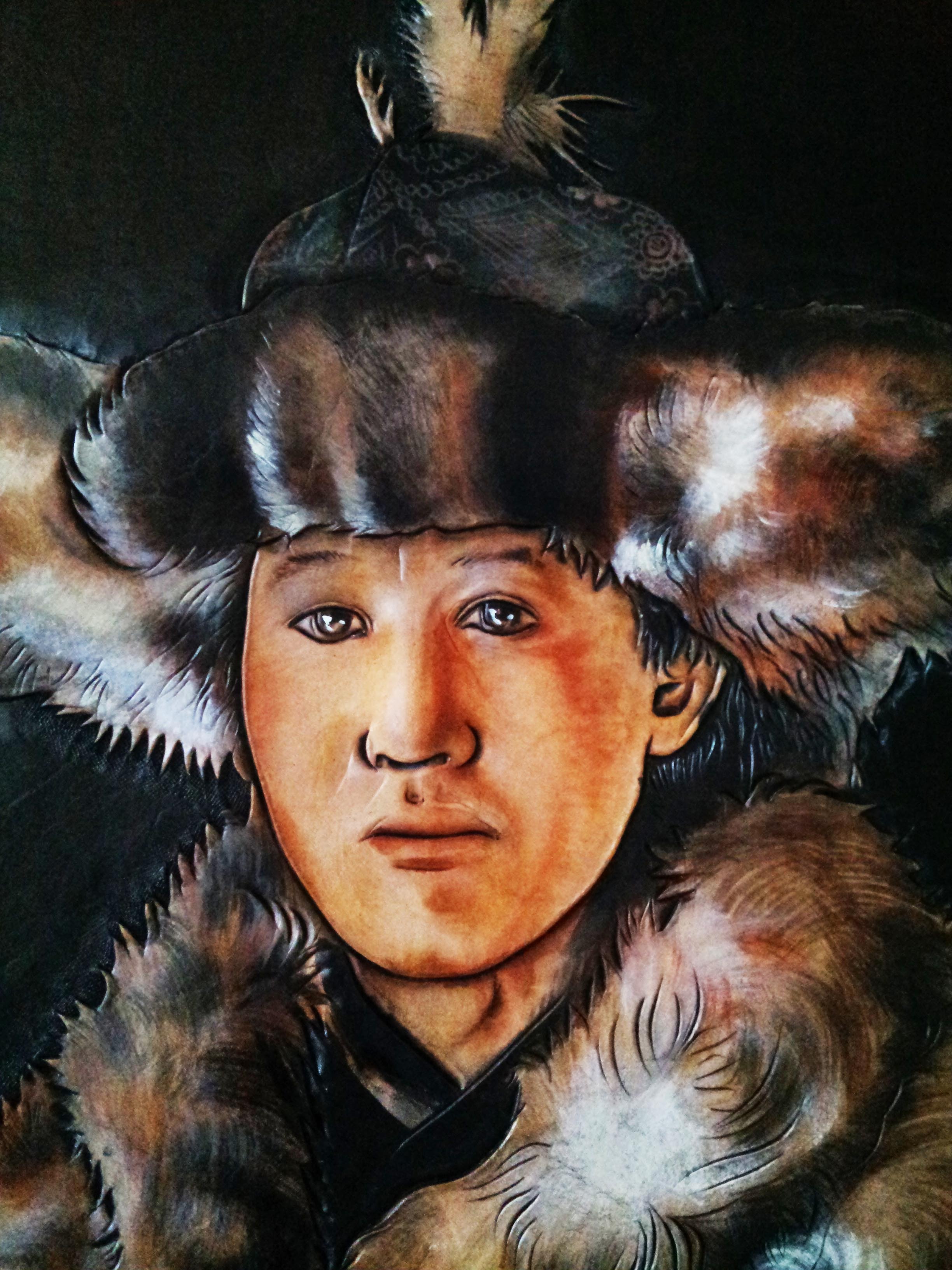 哈萨克族训鹰人皮雕画一