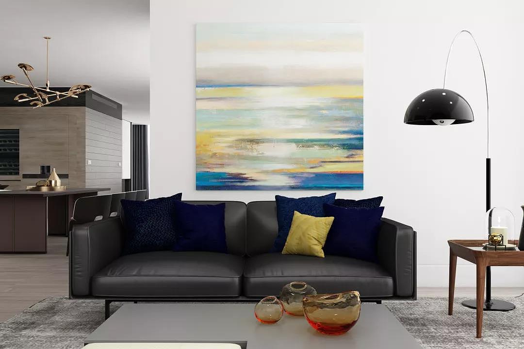 整个空间冷暖色交织,家具的用色与挂画色彩潜在呼应,形成海边晚霞的