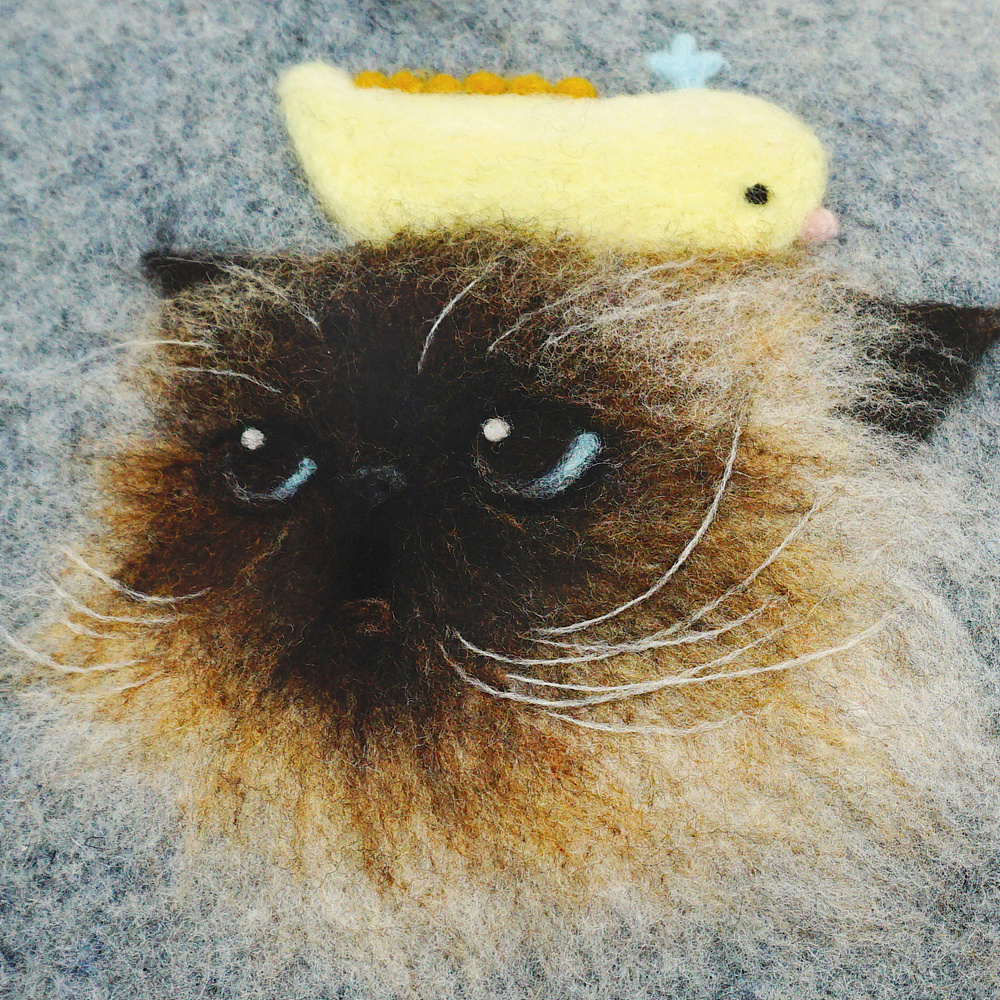 帽子上的羊毛毡画