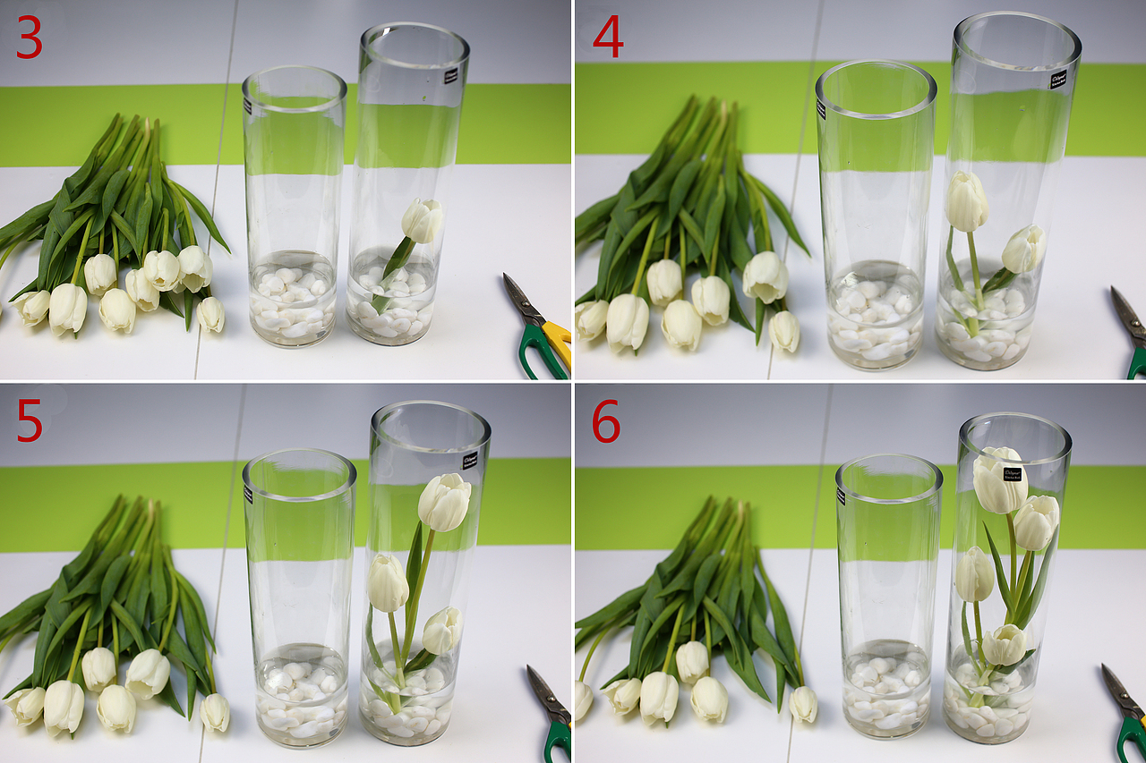 用剪刀倾斜45°剪郁金香的根 第一枝最短插入瓶中 后面依次比第一枝长一点插入瓶中