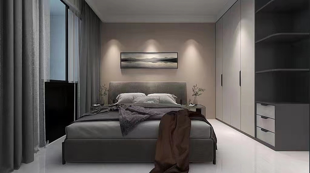 次卧没有多余的色彩没有多余的灯饰,黑白灰主题色外加入了米色的协调,减少了冷淡系色彩的强硬,添加了卧室空间的柔和感。