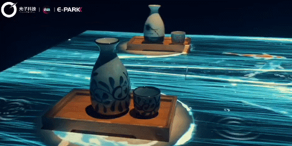 (新媒体装置「光影餐厅」)
新媒体装置「光影餐厅」是以瀑布间的四季为主题,桌面上的瀑布流动,<br>伴随着鱼儿畅游,周围变换的春夏秋冬则是用当季的一种花卉来体现。