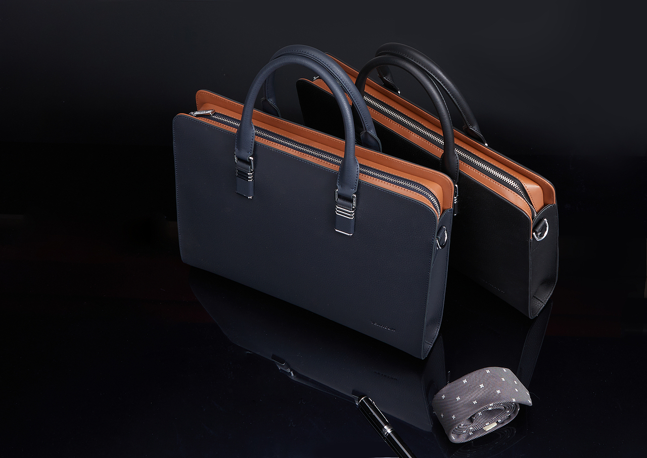 深蓝与棕皮革手提包,简约设计,尽显商务优雅格调