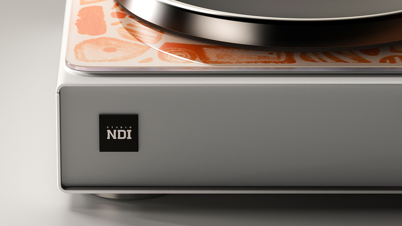 橙色抽象图案与“Studio NDI” 标识