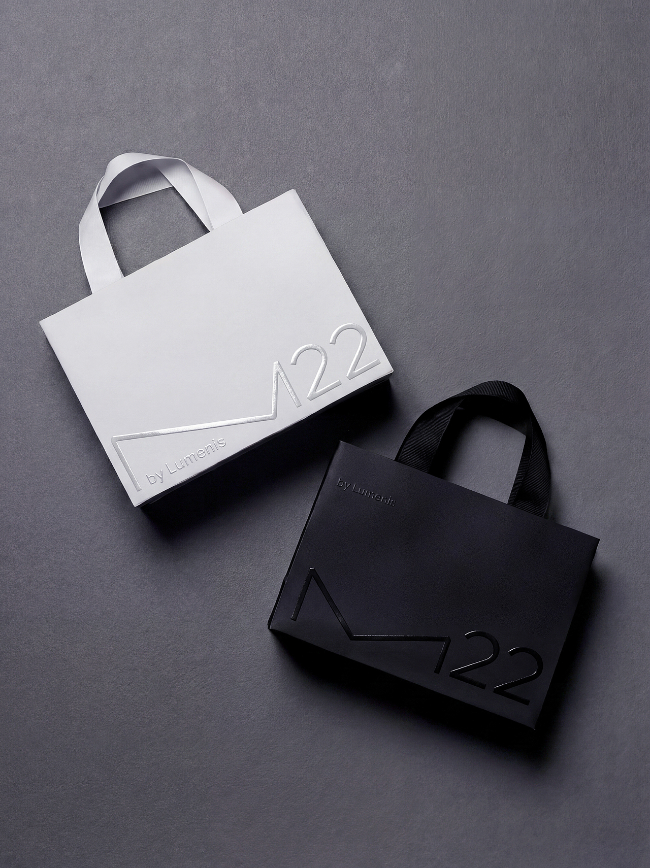 从冷峻科技到优雅雕塑 | M22品牌VI设计